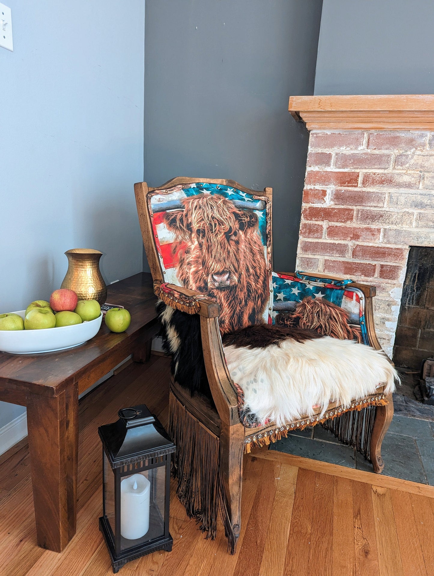 Elevate your farmhouse decor with this stunning Western Style Brown Leather Chair, a perfect blend of rustic charm and vintage appeal. Crafted from reclaimed wood and upcycled materials, this unique piece features a distressed brown leather frame that exudes cowboy cool. The upholstery is adorned with a striking Highland cow print, adding a touch of countryside authenticity, while the goat-skin hides drape gracefully over the seat, offering both comfort and texture.