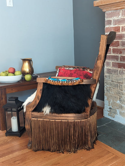 Elevate your farmhouse decor with this stunning Western Style Brown Leather Chair, a perfect blend of rustic charm and vintage appeal. Crafted from reclaimed wood and upcycled materials, this unique piece features a distressed brown leather frame that exudes cowboy cool. The upholstery is adorned with a striking Highland cow print, adding a touch of countryside authenticity, while the goat-skin hides drape gracefully over the seat, offering both comfort and texture.