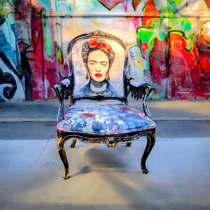 Bring style and character to your home decor with this one-of-a-kind Frida Kahlo vintage French upcycled chair. The chair frame is made of solid wood, painted black, and decorated with gold wax. Chair decsorated with extar large black tassels.