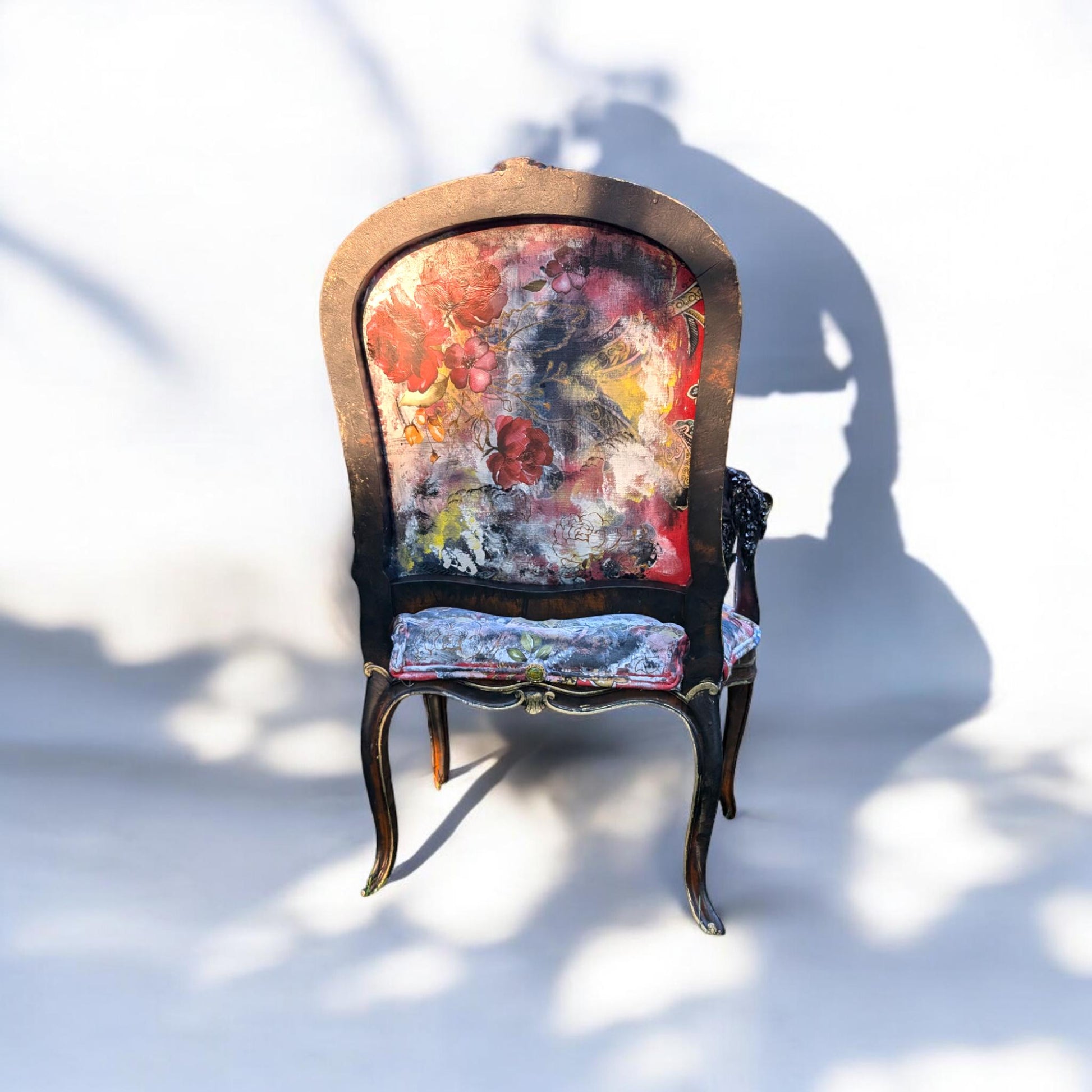 Bring style and character to your home decor with this one-of-a-kind Frida Kahlo vintage French upcycled chair. The chair frame is made of solid wood, painted black, and decorated with gold wax. Chair decsorated with extar large black tassels.