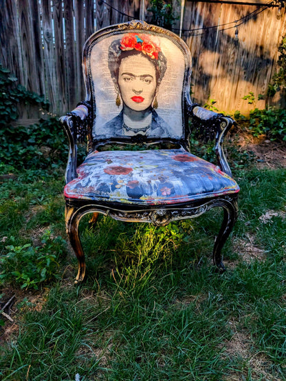 Bring style and character to your home decor with this one-of-a-kind Frida Kahlo vintage French upcycled chair. The chair frame is made of solid wood, painted black, and decorated with gold wax. Chair decsorated with extar large black tassels.