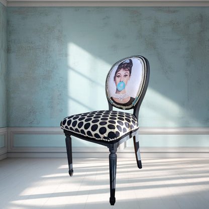 Audrey Hepburn Vanity Chai. Hand-Painted Hollywood Decor. Step into timeless elegance with the Audrey Hepburn Vanity Chair Retro Painted Furniture Pop Art Design Old Hollywood Decor Glamorous Makeup Seat. This uniquely crafted piece combines classic Hollywood charm with vibrant pop art flair, making it a standout addition to your vanity or dressing area. Designed for those who appreciate both style and comfort, this chair offers a nostalgic yet modern touch that elevates any space.