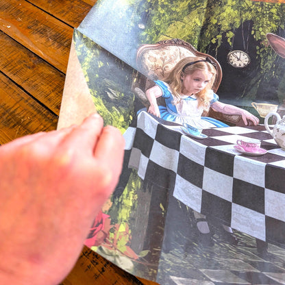 Discover the magic of storytelling with our Alice in Wonderland Decoupage Paper, a vibrant and whimsical addition to your DIY craft supplies. Perfect for adding a touch of fairy core charm to your projects, this high-quality tissue paper features detailed and colorful designs inspired by Lewis Carroll’s beloved characters and scenes. Whether you're creating whimsical home decor, themed party decorations, or unique craft pieces, this decoupage paper brings a splash of fantasy to every project.