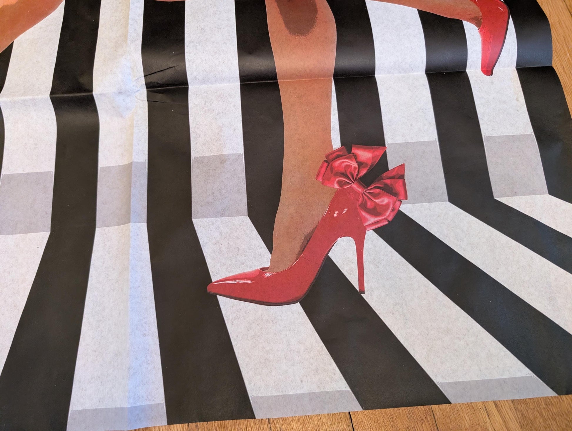 Add a touch of whimsical sophistication to your furniture and crafts with our Funky Decoupage Paper featuring the captivating "Woman in Red Heels" design. Perfect for DIY furniture art, book scrapping, and upcycling, this eye-catching tissue paper combines modern style with playful charm, making every piece uniquely yours. Crafted with high-quality decoupage paper, this design showcases a stylish silhouette of a woman’s legs in striking red high heels, set against a bold striped background.