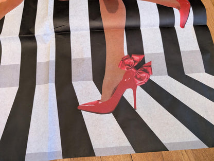 Add a touch of whimsical sophistication to your furniture and crafts with our Funky Decoupage Paper featuring the captivating "Woman in Red Heels" design. Perfect for DIY furniture art, book scrapping, and upcycling, this eye-catching tissue paper combines modern style with playful charm, making every piece uniquely yours. Crafted with high-quality decoupage paper, this design showcases a stylish silhouette of a woman’s legs in striking red high heels, set against a bold striped background.