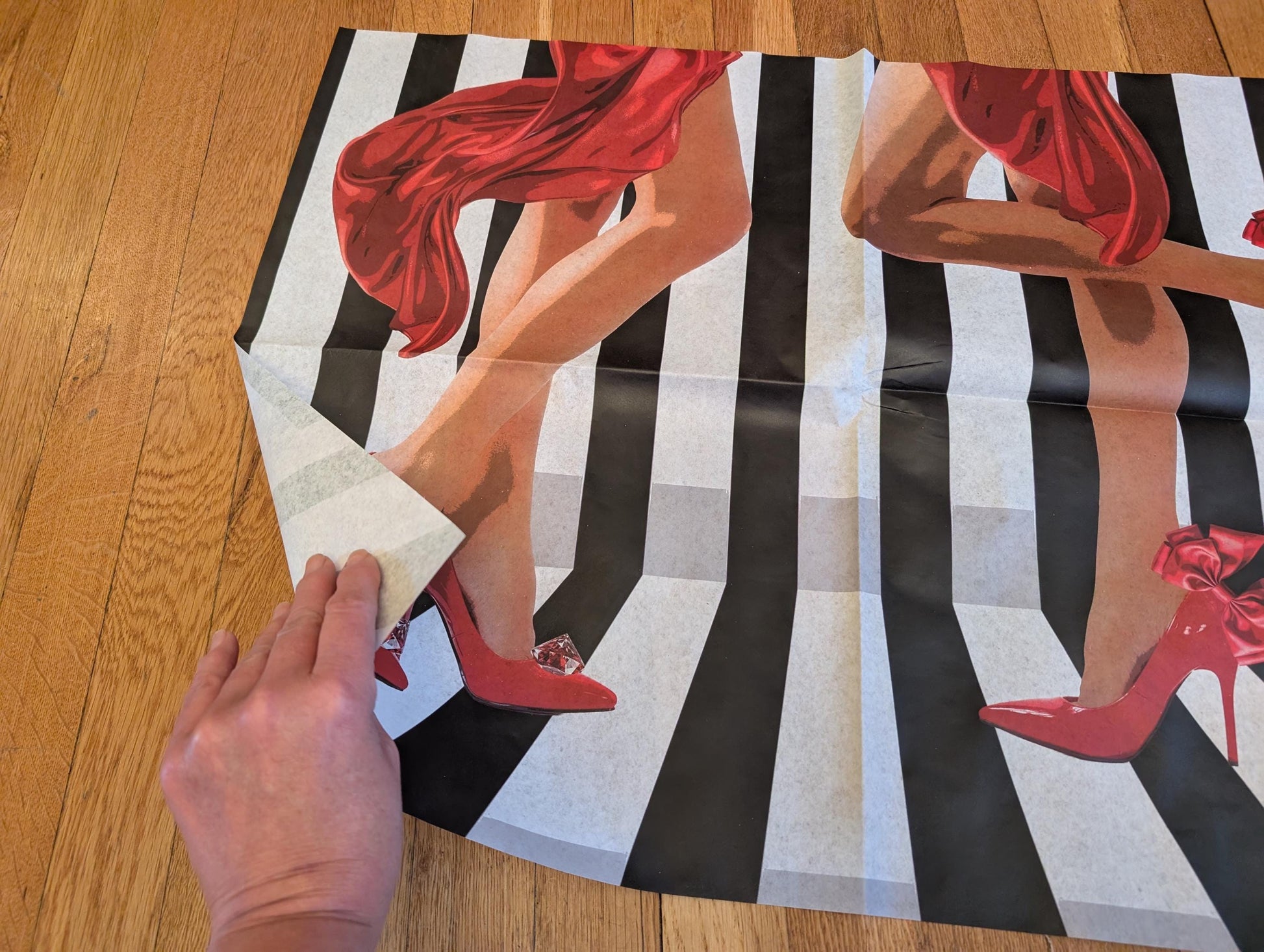 Add a touch of whimsical sophistication to your furniture and crafts with our Funky Decoupage Paper featuring the captivating "Woman in Red Heels" design. Perfect for DIY furniture art, book scrapping, and upcycling, this eye-catching tissue paper combines modern style with playful charm, making every piece uniquely yours. Crafted with high-quality decoupage paper, this design showcases a stylish silhouette of a woman’s legs in striking red high heels, set against a bold striped background.