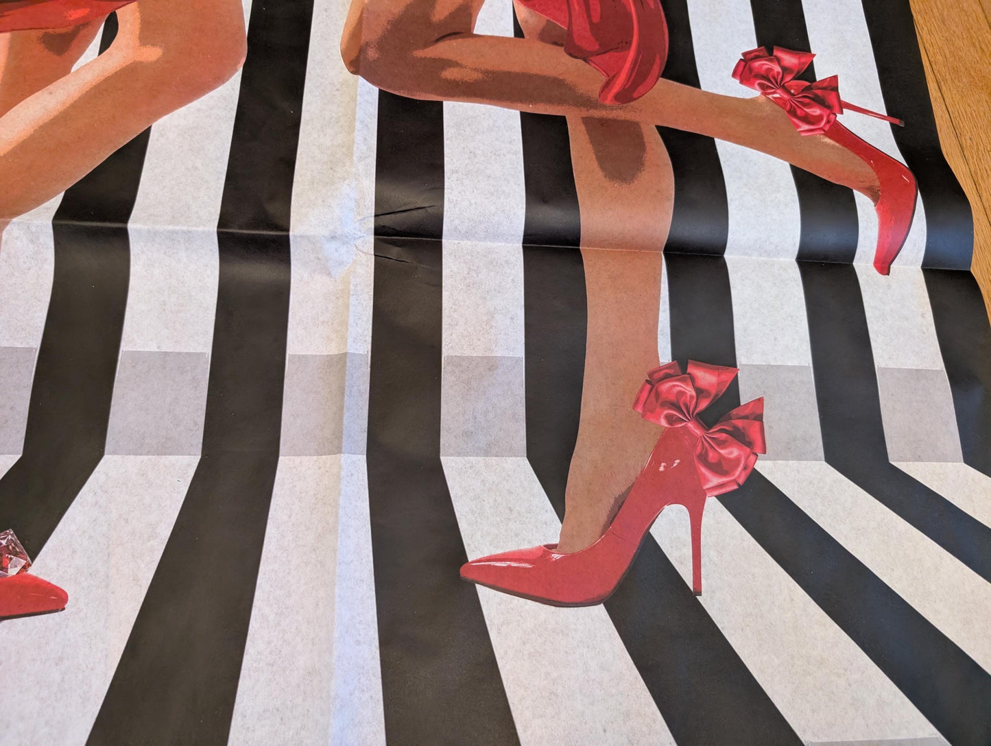Add a touch of whimsical sophistication to your furniture and crafts with our Funky Decoupage Paper featuring the captivating "Woman in Red Heels" design. Perfect for DIY furniture art, book scrapping, and upcycling, this eye-catching tissue paper combines modern style with playful charm, making every piece uniquely yours. Crafted with high-quality decoupage paper, this design showcases a stylish silhouette of a woman’s legs in striking red high heels, set against a bold striped background.