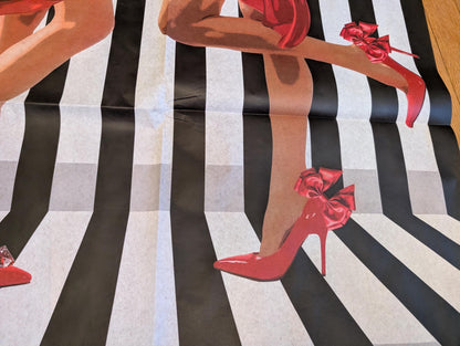 Add a touch of whimsical sophistication to your furniture and crafts with our Funky Decoupage Paper featuring the captivating "Woman in Red Heels" design. Perfect for DIY furniture art, book scrapping, and upcycling, this eye-catching tissue paper combines modern style with playful charm, making every piece uniquely yours. Crafted with high-quality decoupage paper, this design showcases a stylish silhouette of a woman’s legs in striking red high heels, set against a bold striped background.