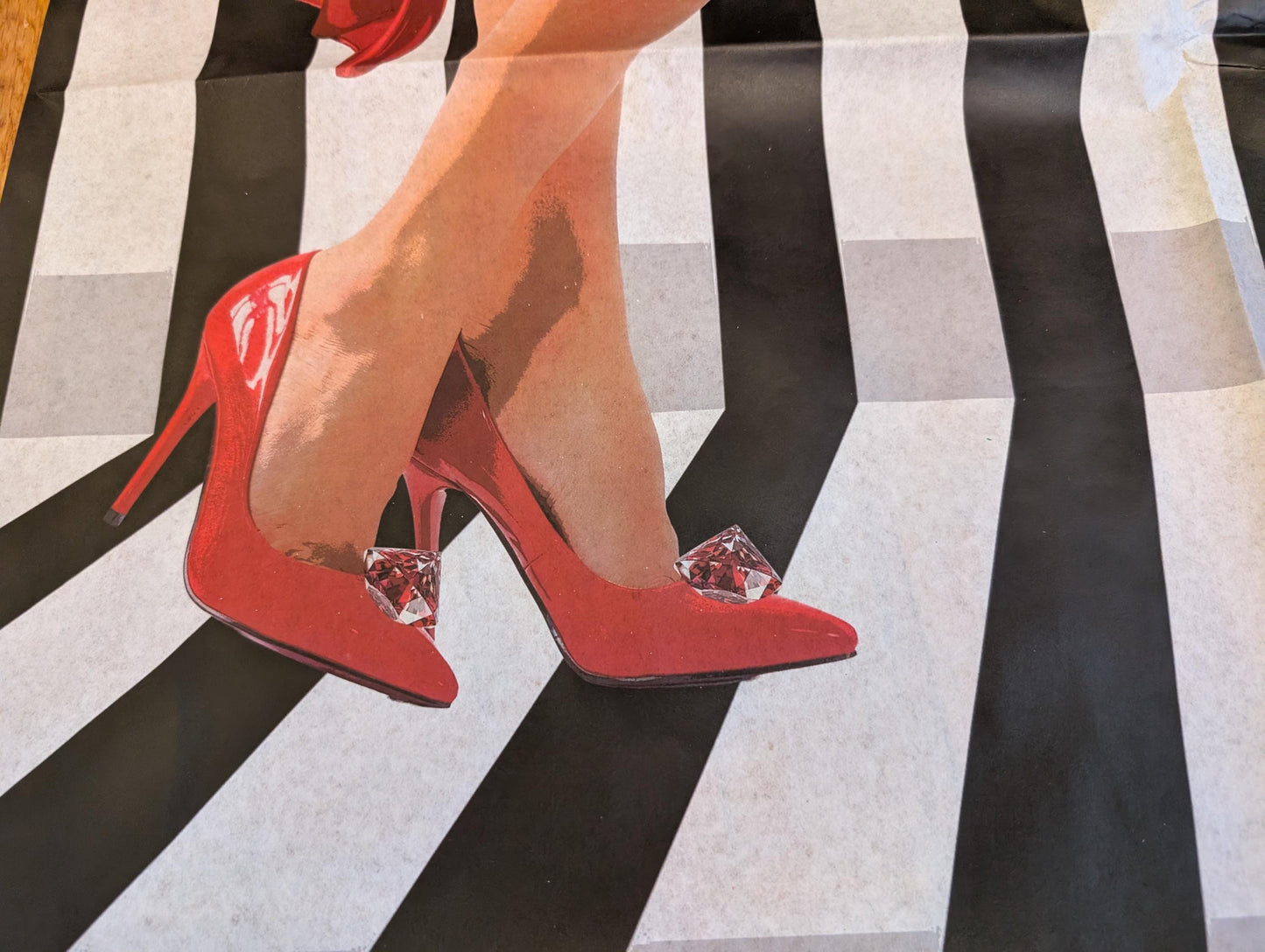 Add a touch of whimsical sophistication to your furniture and crafts with our Funky Decoupage Paper featuring the captivating "Woman in Red Heels" design. Perfect for DIY furniture art, book scrapping, and upcycling, this eye-catching tissue paper combines modern style with playful charm, making every piece uniquely yours. Crafted with high-quality decoupage paper, this design showcases a stylish silhouette of a woman’s legs in striking red high heels, set against a bold striped background.