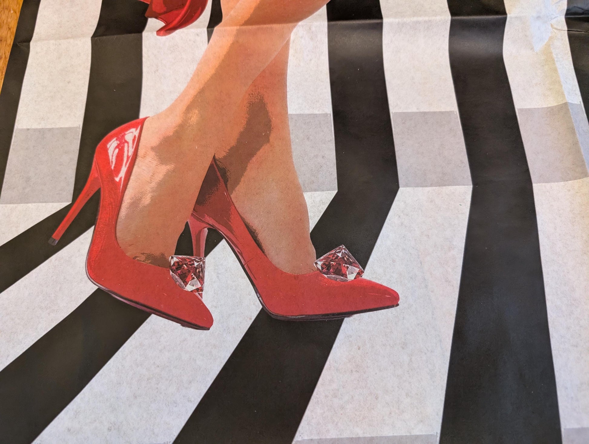 Add a touch of whimsical sophistication to your furniture and crafts with our Funky Decoupage Paper featuring the captivating "Woman in Red Heels" design. Perfect for DIY furniture art, book scrapping, and upcycling, this eye-catching tissue paper combines modern style with playful charm, making every piece uniquely yours. Crafted with high-quality decoupage paper, this design showcases a stylish silhouette of a woman’s legs in striking red high heels, set against a bold striped background.