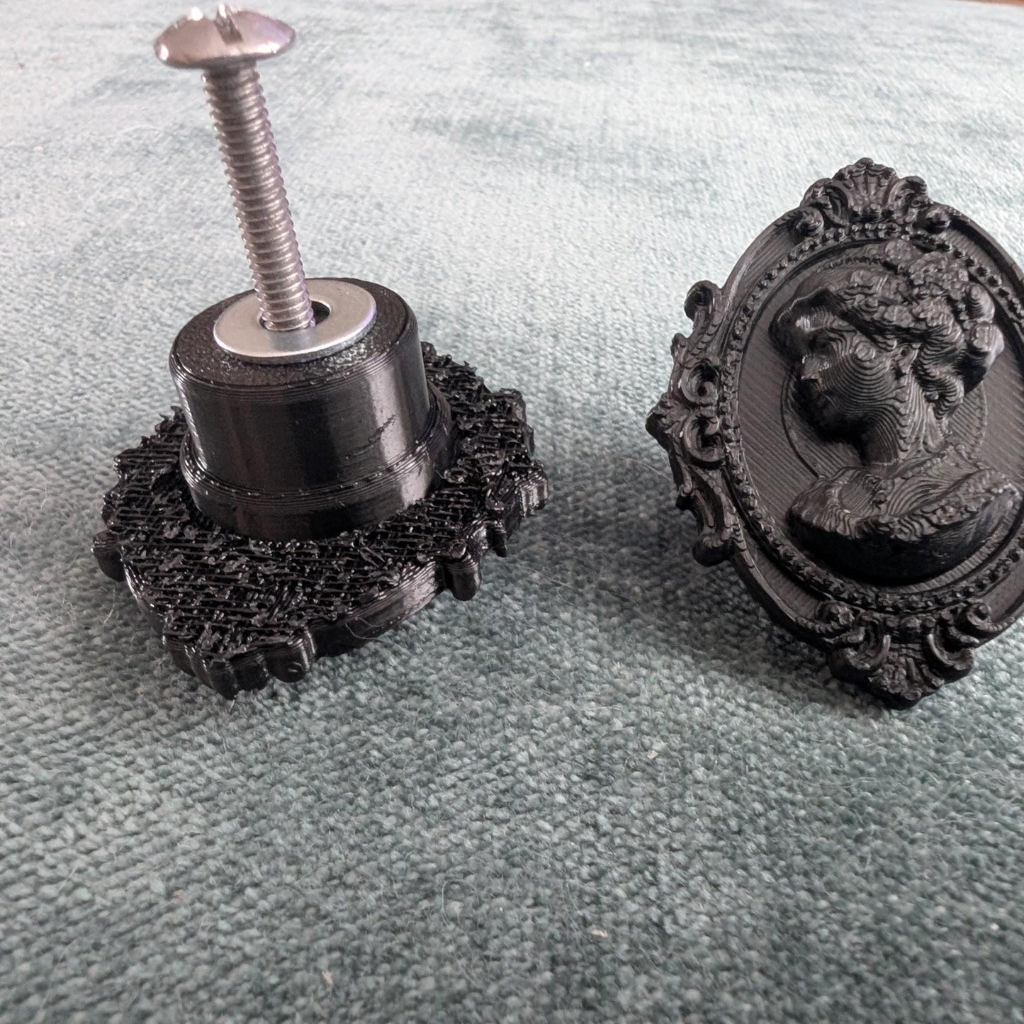 Add a touch of gothic elegance to your furniture with this stunning 3D-printed Cameo Cabinet Drawer Pull. Designed to elevate your cabinetry, this drawer knob combines vintage charm with modern craftsmanship, making it perfect for furniture hardware, wardrobe handles, kitchen hardware, and bathroom remodels. Crafted with attention to detail, this gothic-inspired drawer pull features intricate carved accents that evoke a sense of timeless sophistication.