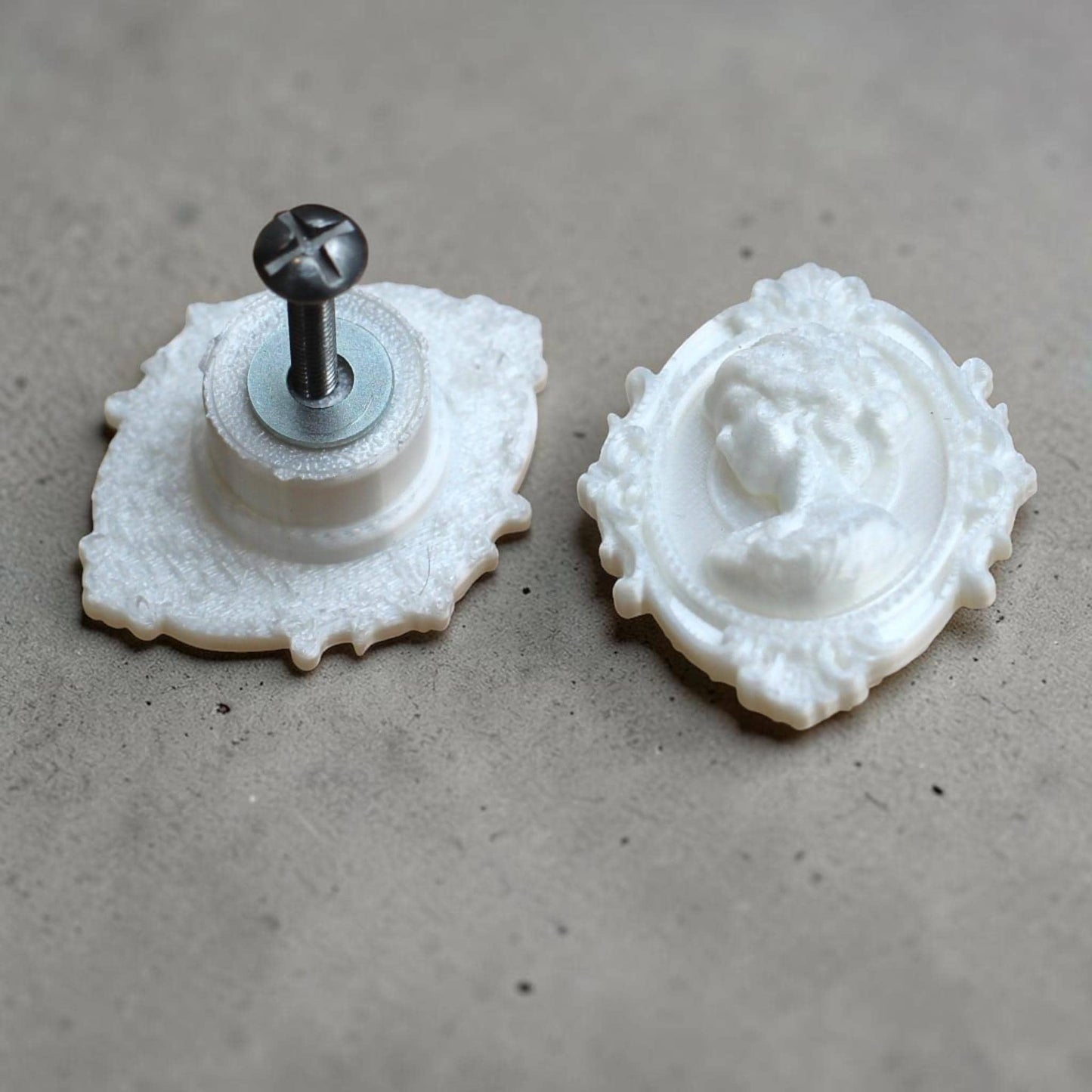 Add a touch of gothic elegance to your furniture with this stunning 3D-printed Cameo Cabinet Drawer Pull. Designed to elevate your cabinetry, this drawer knob combines vintage charm with modern craftsmanship, making it perfect for furniture hardware, wardrobe handles, kitchen hardware, and bathroom remodels. Crafted with attention to detail, this gothic-inspired drawer pull features intricate carved accents that evoke a sense of timeless sophistication.