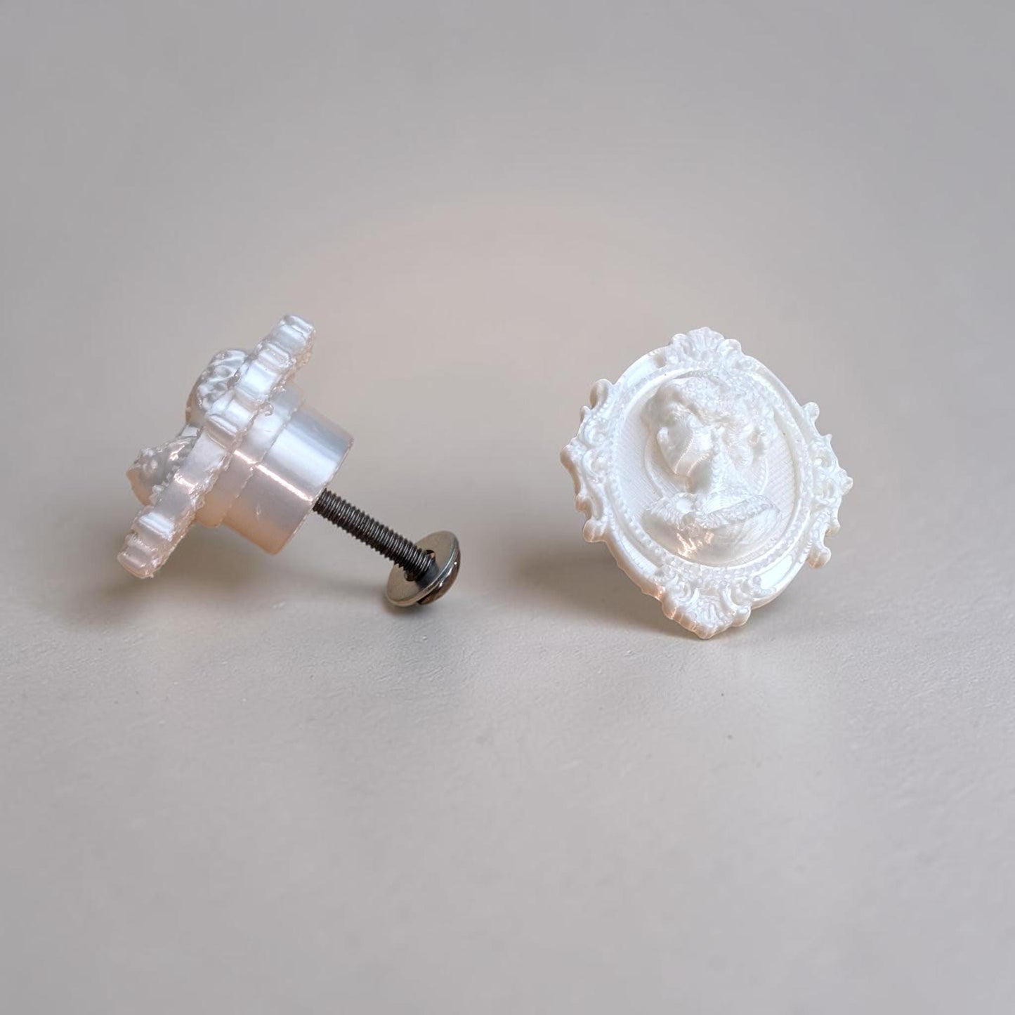 Add a touch of gothic elegance to your furniture with this stunning 3D-printed Cameo Cabinet Drawer Pull. Designed to elevate your cabinetry, this drawer knob combines vintage charm with modern craftsmanship, making it perfect for furniture hardware, wardrobe handles, kitchen hardware, and bathroom remodels. Crafted with attention to detail, this gothic-inspired drawer pull features intricate carved accents that evoke a sense of timeless sophistication.